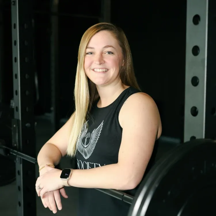 Meg Iburg leaning on a squat rack