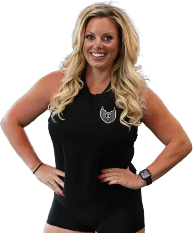 Chelsy Dahms, owner and head coach of Valkyrie Society, smiling with her hands on her hips