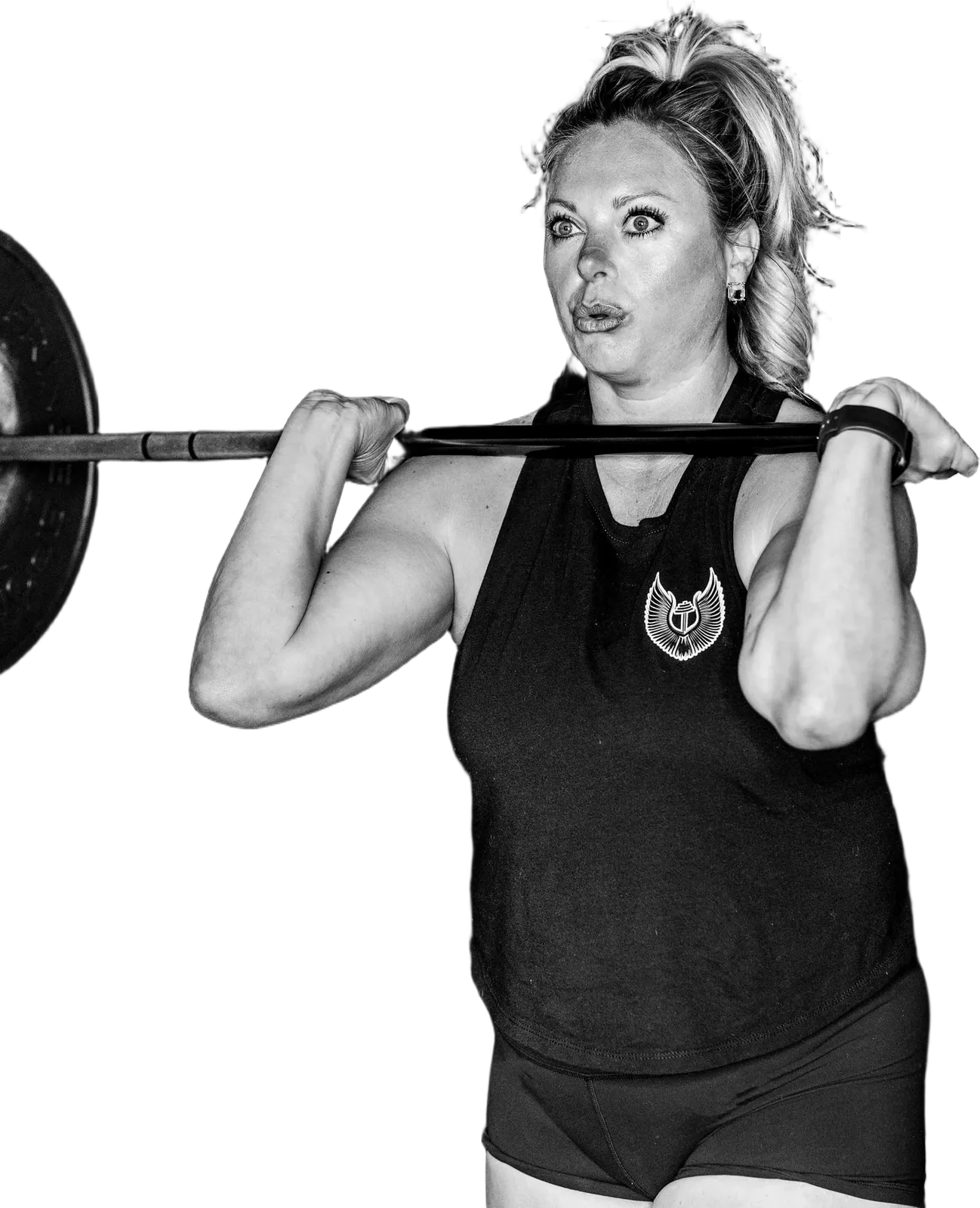 A Valkyrie Society member holding a barbell in the front rack position
